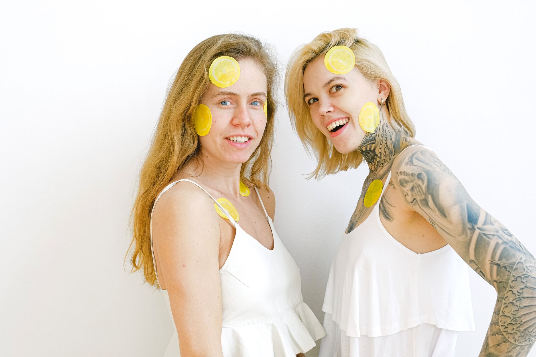 Colorful lemon vibrators and sex toys arranged on a bright yellow background