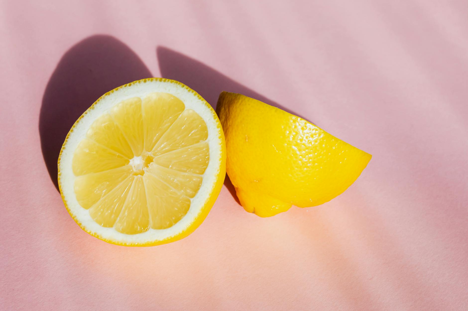 Bright yellow lemons arranged on a pastel background, symbolizing fresh communication and openness